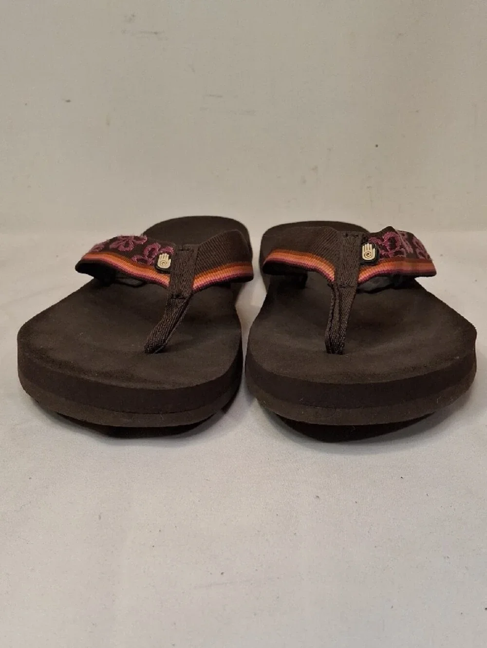 Teva Men's Brown Thong Flip Flops with Mauve and Orange Accents.Lightly Worn
